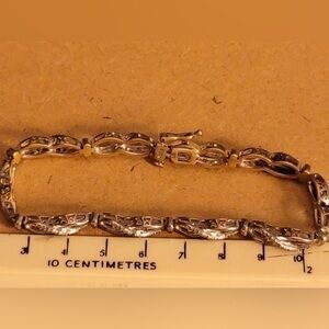 Beautiful silver tone sparkly bracelet. See close up to get feel for int…